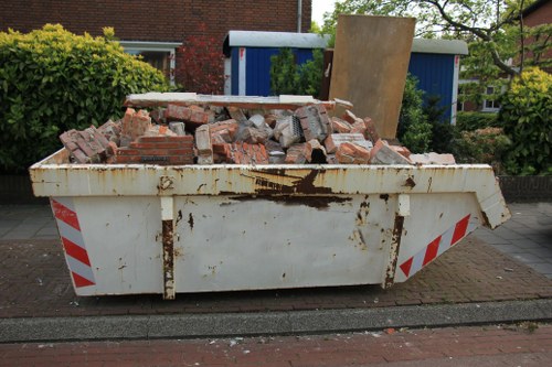 Construction site with waste being cleared in Colliers Wood