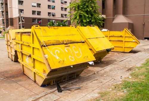 Construction site with builders waste being cleared in Bayswater