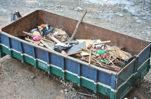 Workers sorting construction debris for recycling