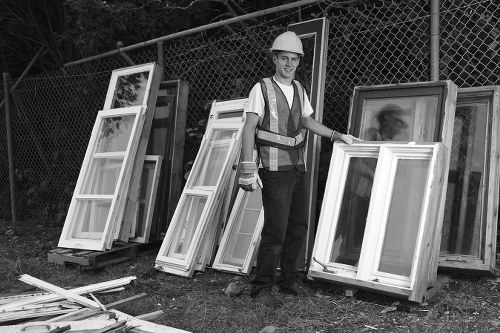 Workers managing builders waste clearance at a construction site in Sydenham Hill