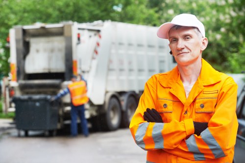 Builders clearing construction waste in Castelnau