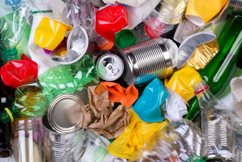 Sorted building waste with recycling bins