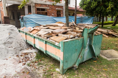 Workers sorting assorted building debris for recycling