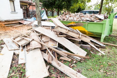 Workers handling construction waste in Parsons Green