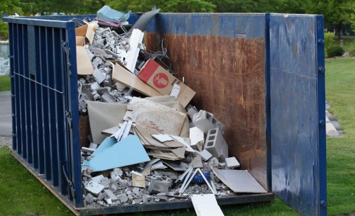 Construction site with waste materials ready for clearance in Acton