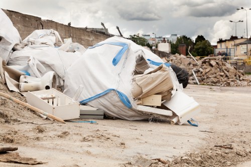 Construction site with waste clearance services in action