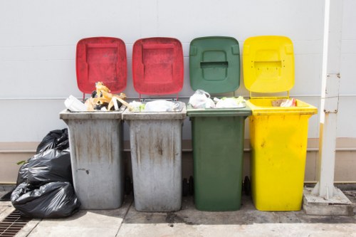 Construction workers managing builders waste clearance in Islington