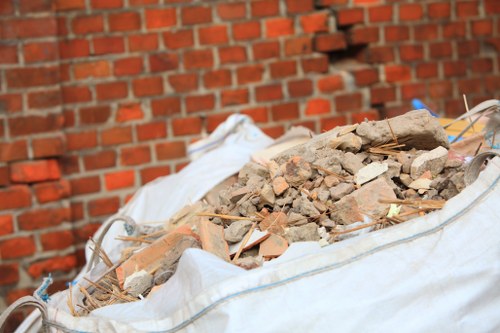 Construction debris removal in progress at a Harlington site