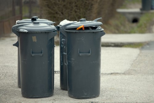 Workers managing builders waste on a construction site