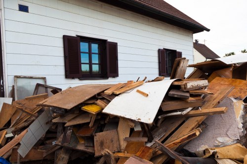 Builders sorting construction debris for clearance