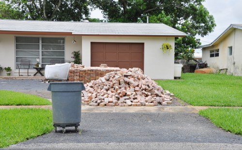 Workers safely removing builders waste from a construction site