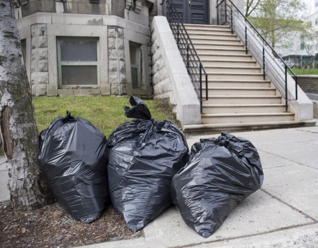 Workers sorting construction debris for recycling