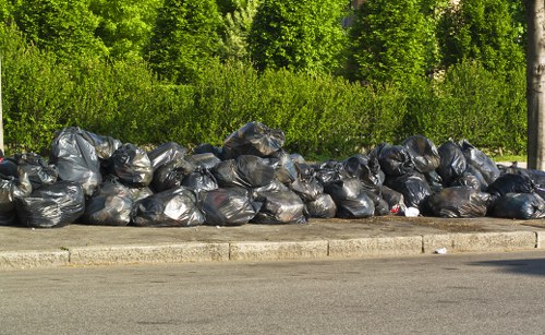 Workers sorting waste materials on a Harrow building site