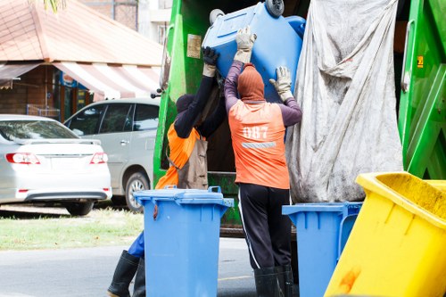 Professional waste clearance service at a construction site.