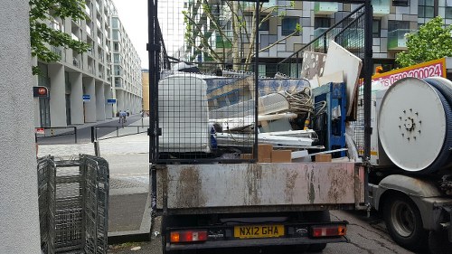 Waste clearance trucks in Norbiton during cleanup