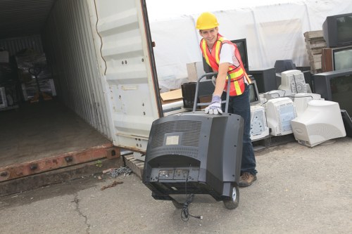 Workers sorting timber waste