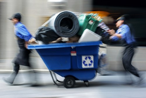 Clearance experts handling waste safely outdoors