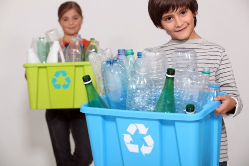 Workers sorting recyclable construction debris