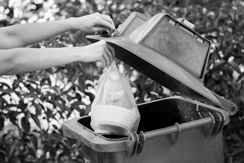 Workers managing builders waste clearance