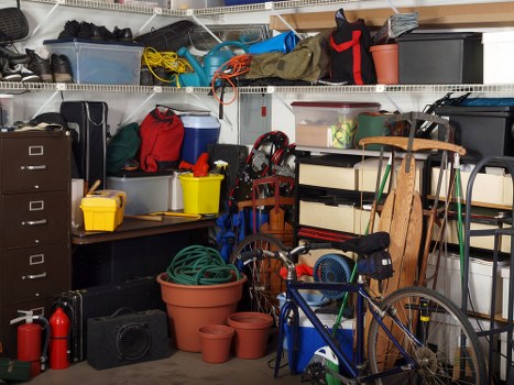 Workers clearing builders waste in South Hornchurch with safety gear