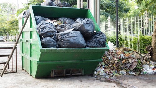 Worker sorting recycled construction materials